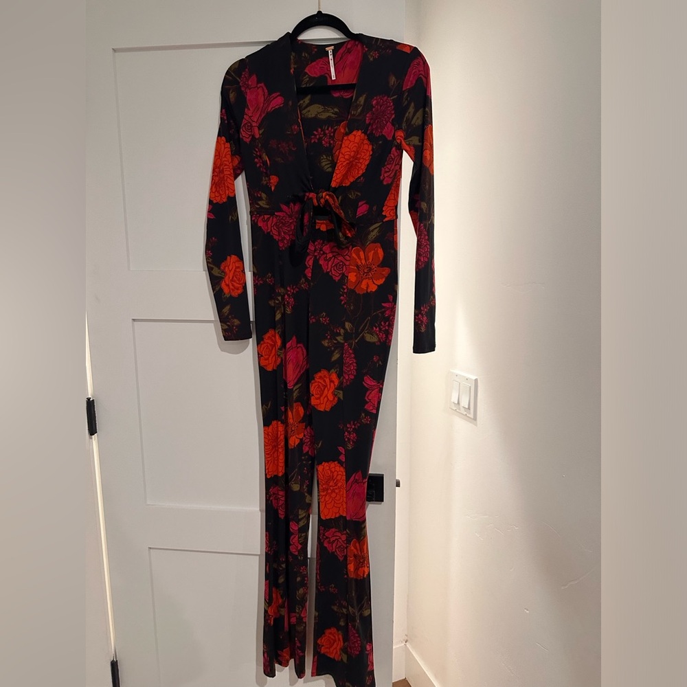 Red, pink, and black floral Free People Jumpsuit. XS